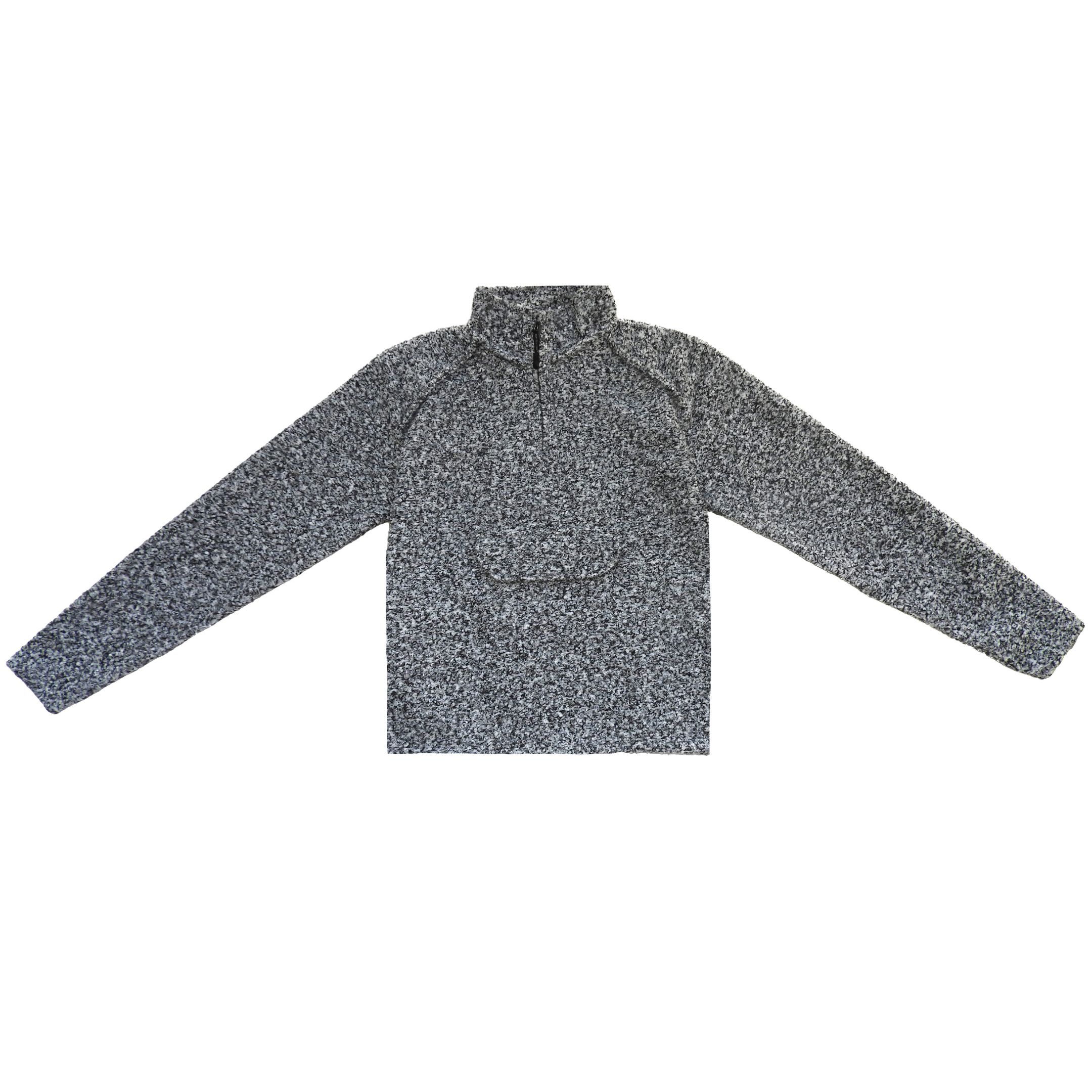 Flat lay photo of grey, white, and black boucle sweater.