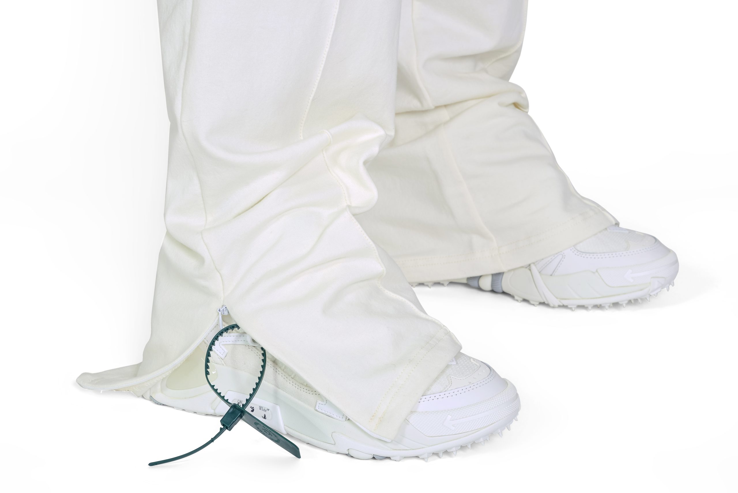 Wide Leg Slit Trousers in Off White, close up angle of side slit.
