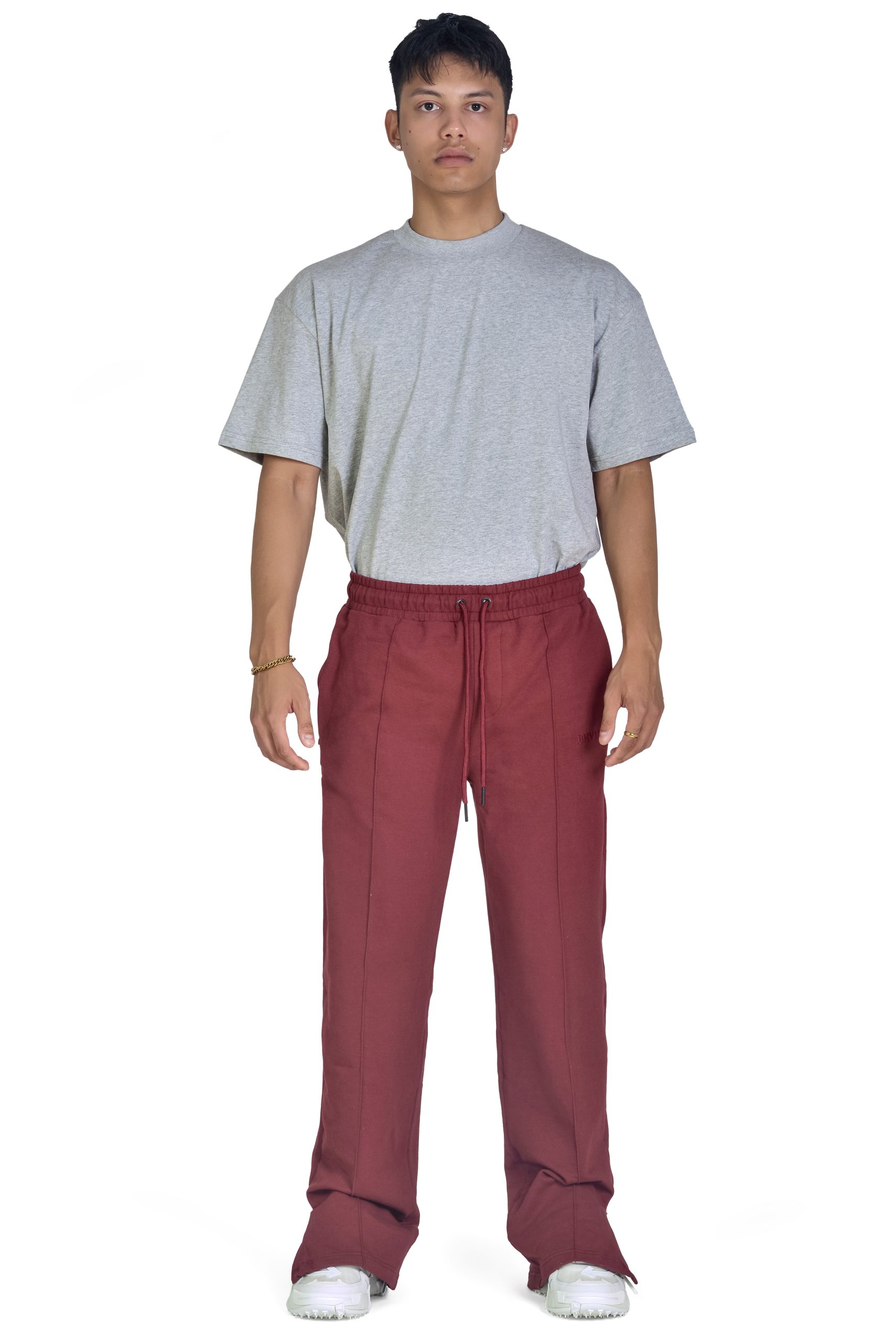 Wide-leg trouser for men and women with adjustable side slits, pockets, and drawstring. The perfect elevated sweatpants for everyday. Maroon Color.