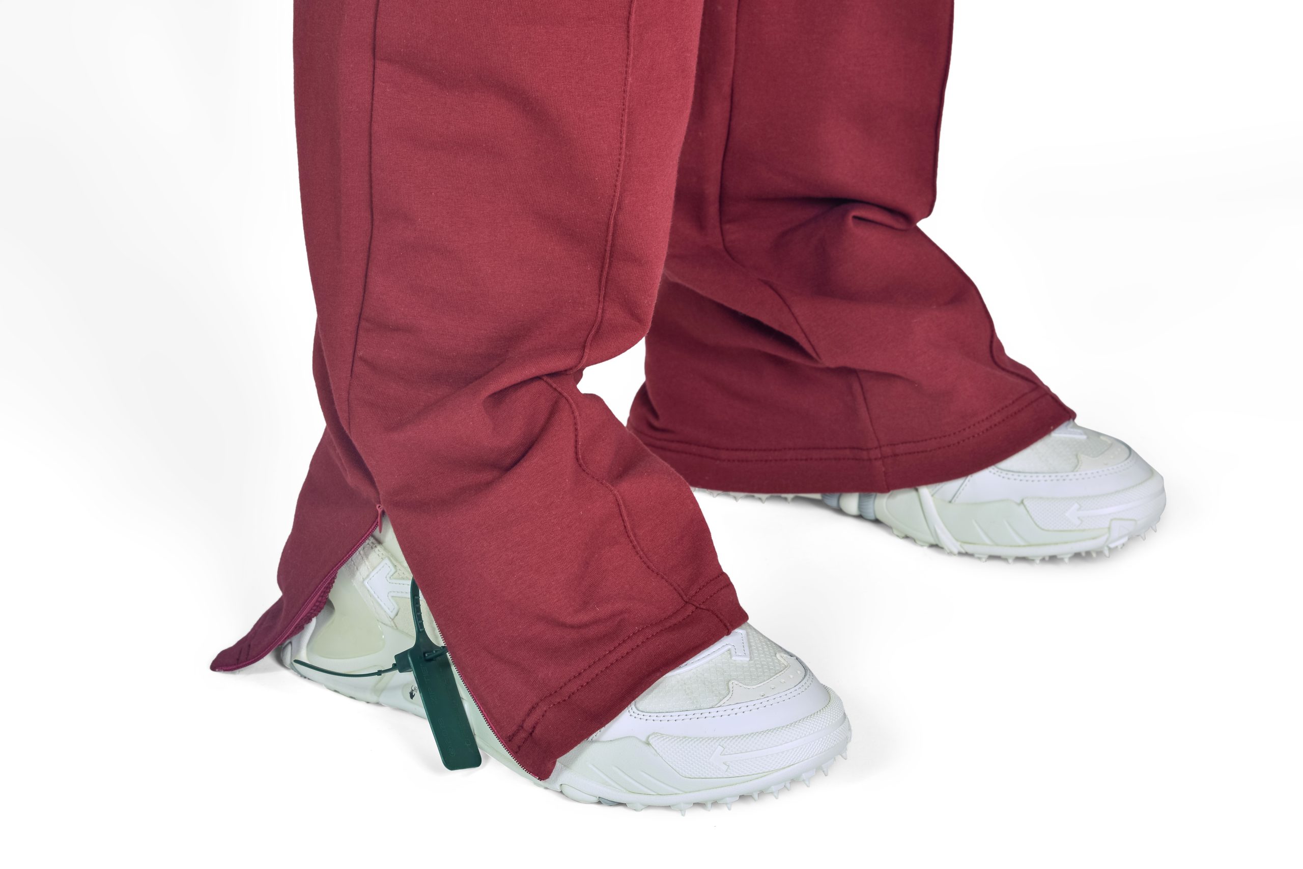 Wide Leg Slit Trousers in Maroon., close up photo of side slit and zipper.